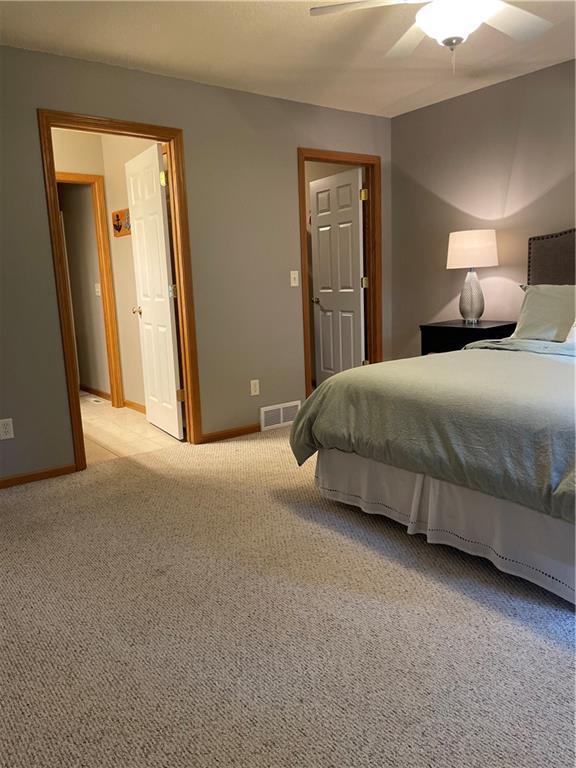 1762 Wilson Ave, Menomonie, WI 54751 - bedroom featuring light carpet, baseboards, and a ceiling fan