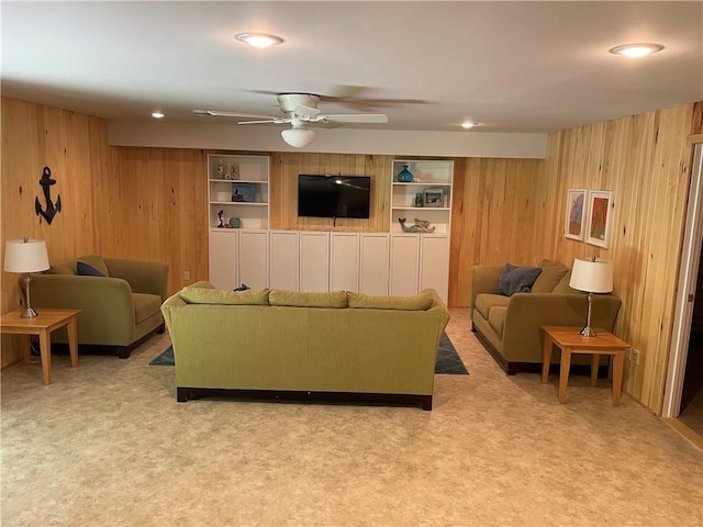 1762 Wilson Ave, Menomonie, WI 54751 - living room featuring wood walls, ceiling fan, recessed lighting, and carpet