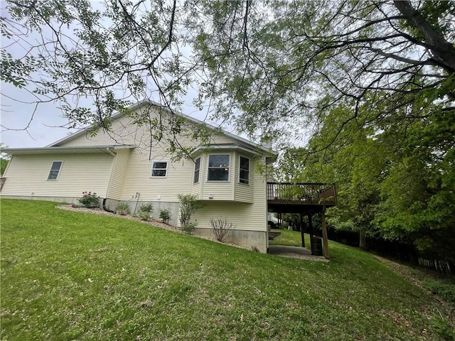 1762 Wilson Ave, Menomonie, WI 54751 - view of property exterior featuring a wooden deck and a yard