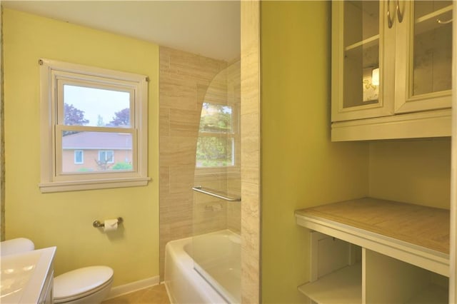3053 Jupiter Ave, Eau Claire, WI 54703 - full bath featuring toilet, baseboards, vanity, tile patterned floors, and  shower combination