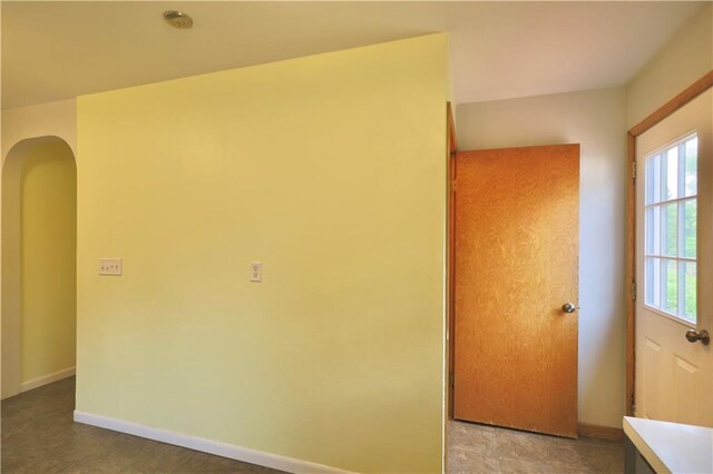 3053 Jupiter Ave, Eau Claire, WI 54703 - unfurnished room featuring arched walkways, healthy amount of natural light, and baseboards