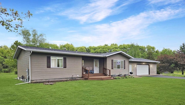 5321 Breezy Pine Dr, Wisconsin Rapids, WI 54494 - ranch-style house featuring an attached garage, driveway, and a front lawn