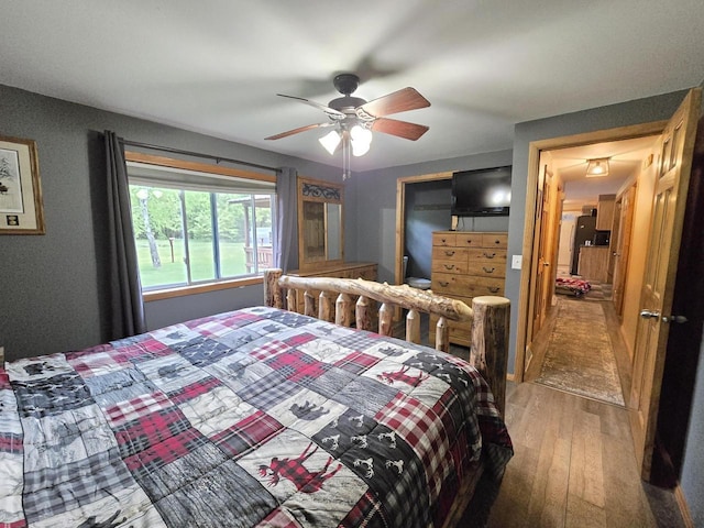 5321 Breezy Pine Dr, Wisconsin Rapids, WI 54494 - bedroom featuring hardwood / wood-style floors and ceiling fan