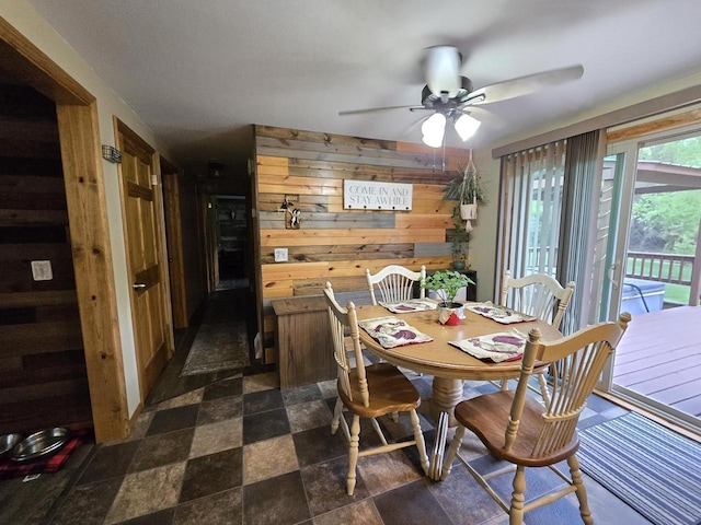 5321 Breezy Pine Dr, Wisconsin Rapids, WI 54494 - dining area featuring wood walls and ceiling fan
