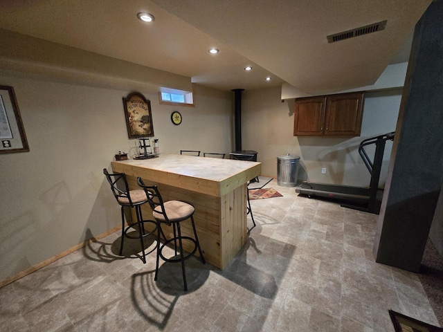5321 Breezy Pine Dr, Wisconsin Rapids, WI 54494 - bar area featuring a wood stove and recessed lighting