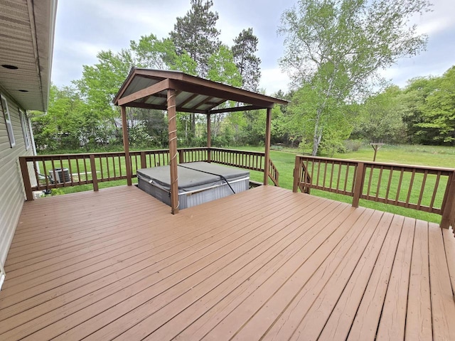 5321 Breezy Pine Dr, Wisconsin Rapids, WI 54494 - wooden terrace with a covered hot tub, a lawn, and view of wooded area