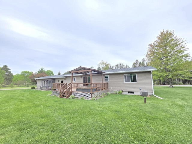 5321 Breezy Pine Dr, Wisconsin Rapids, WI 54494 - back of house featuring central AC, a yard, and a deck