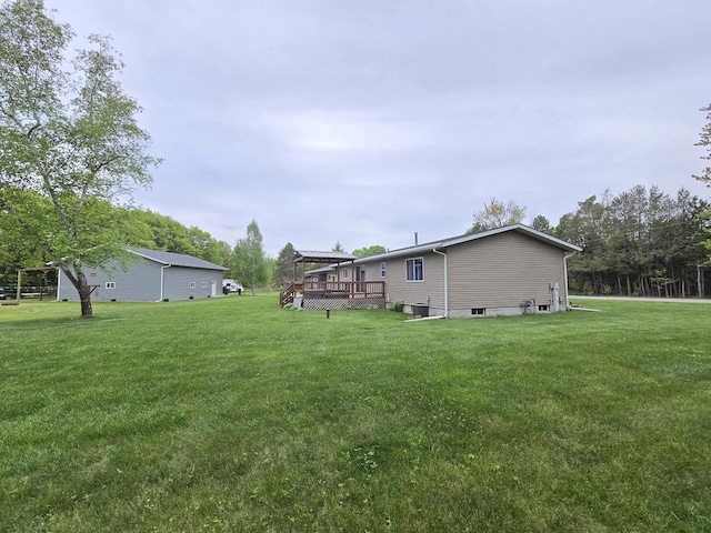 5321 Breezy Pine Dr, Wisconsin Rapids, WI 54494 - view of green lawn featuring a deck