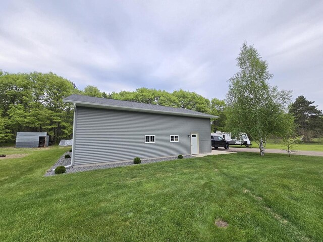 5321 Breezy Pine Dr, Wisconsin Rapids, WI 54494 - view of home's exterior featuring a yard