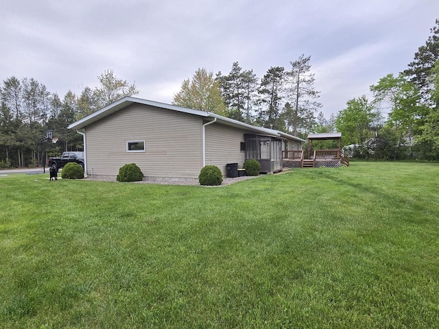 5321 Breezy Pine Dr, Wisconsin Rapids, WI 54494 - view of side of home featuring a deck and a yard