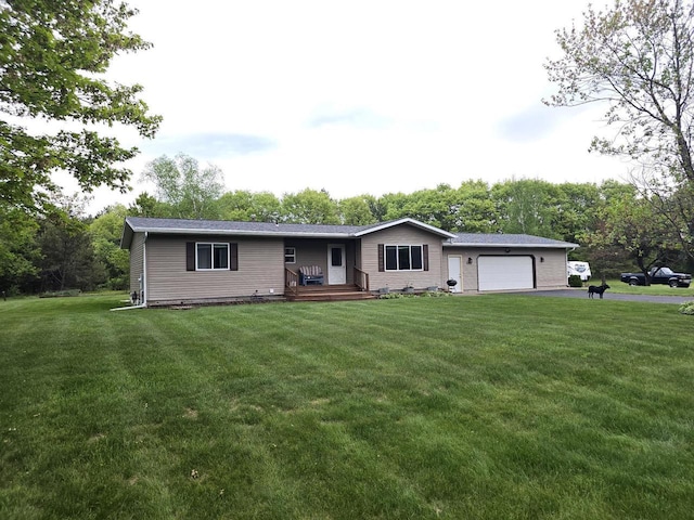 5321 Breezy Pine Dr, Wisconsin Rapids, WI 54494 - ranch-style house with an attached garage, asphalt driveway, and a front yard