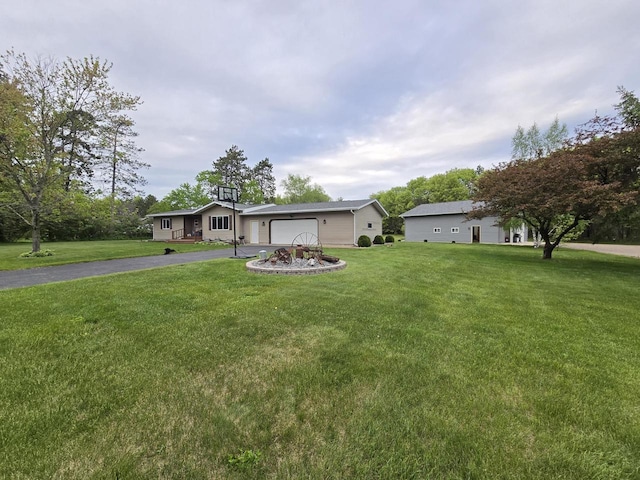 5321 Breezy Pine Dr, Wisconsin Rapids, WI 54494 - ranch-style house with driveway, a front lawn, and a garage