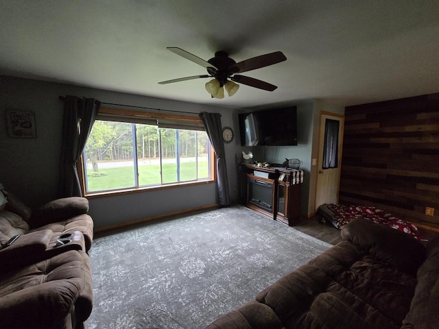5321 Breezy Pine Dr, Wisconsin Rapids, WI 54494 - living area with a ceiling fan and wooden walls