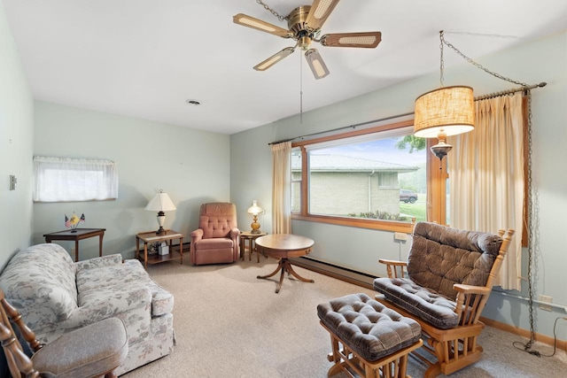5743 Island View Ct, Waterford, WI 53185 - carpeted living area with a baseboard radiator, ceiling fan, and baseboards