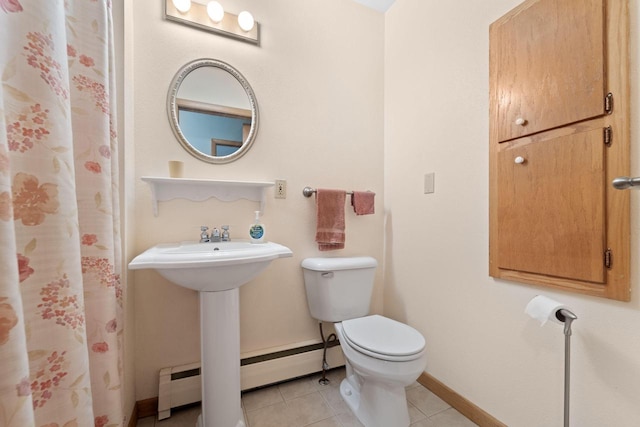 5743 Island View Ct, Waterford, WI 53185 - full bathroom with toilet, baseboards, tile patterned floors, and a baseboard heating unit