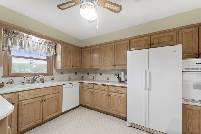 5743 Island View Ct, Waterford, WI 53185 - kitchen with white appliances, a sink, light countertops, and a ceiling fan