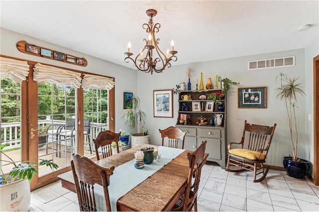 2322 243rd Ave, Cushing, WI 54006 - dining room featuring a chandelier, light marble finish flooring, and french doors
