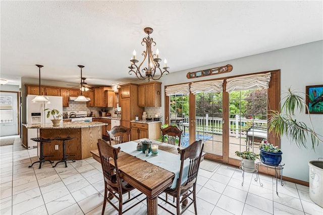 2322 243rd Ave, Cushing, WI 54006 - dining space featuring a chandelier and light marble finish floors