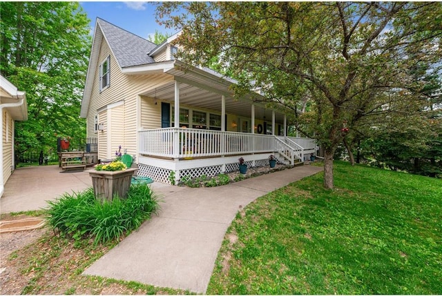 2322 243rd Ave, Cushing, WI 54006 - view of front of house featuring a porch, a front lawn, and a shingled roof