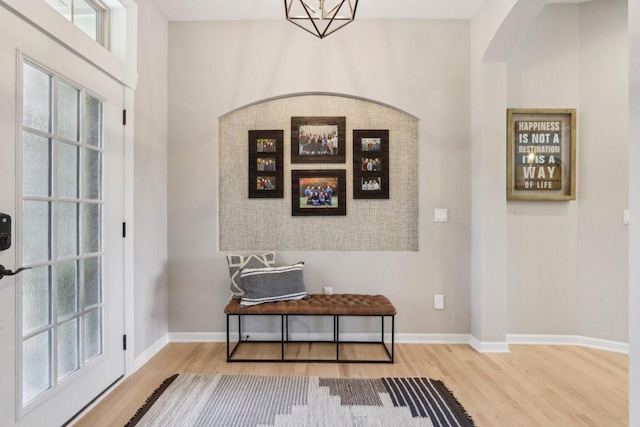 1766 Derby Ln, Oconomowoc, WI 53066 - entryway with wood finished floors, baseboards, and a chandelier