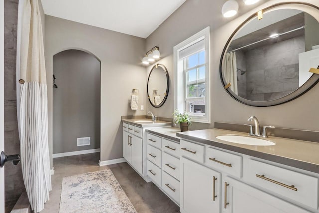 1766 Derby Ln, Oconomowoc, WI 53066 - full bath featuring double vanity, baseboards, and curtained shower
