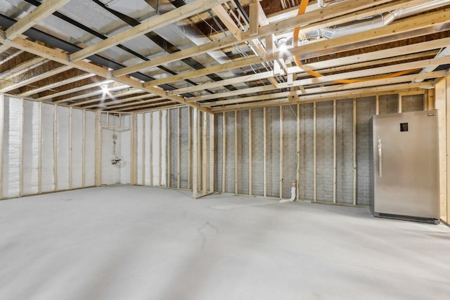 1766 Derby Ln, Oconomowoc, WI 53066 - below grade area featuring freestanding refrigerator