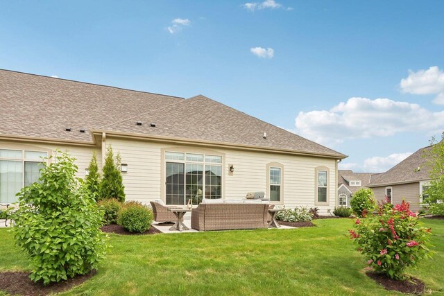 1766 Derby Ln, Oconomowoc, WI 53066 - back of property featuring a yard, outdoor lounge area, and a patio area