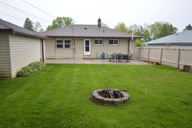 1781 Spruce Ct, South Milwaukee, WI 53172 - back of house featuring a patio area, a chimney, an outdoor fire pit, and a shingled roof