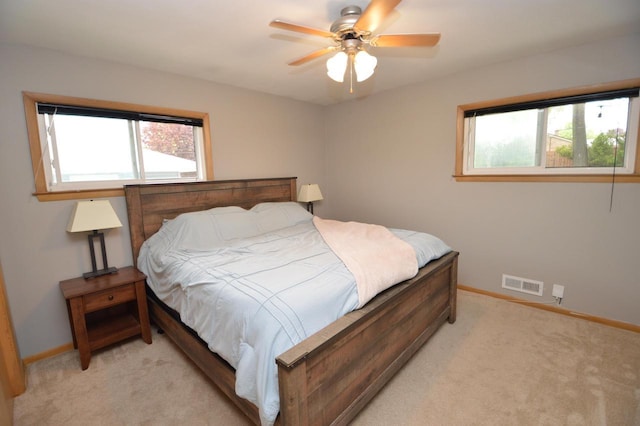 1781 Spruce Ct, South Milwaukee, WI 53172 - bedroom featuring multiple windows, light colored carpet, and baseboards
