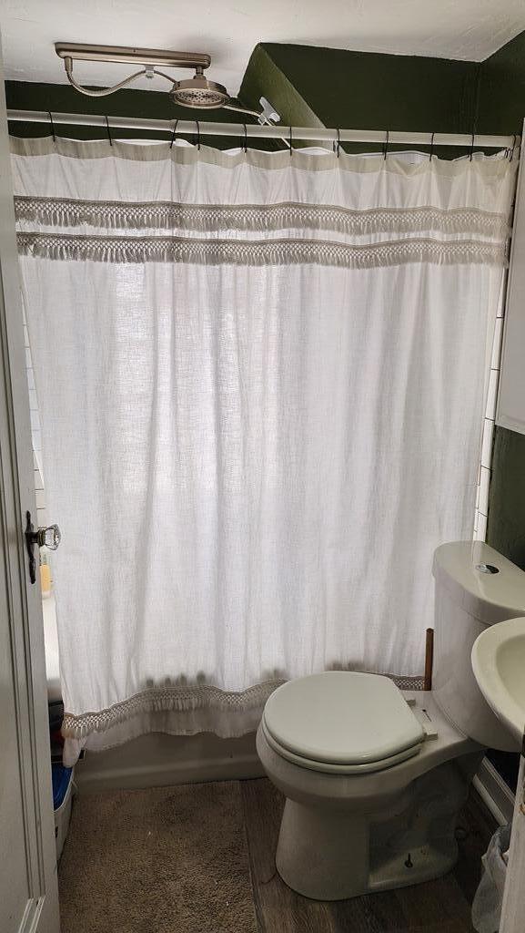 2126 S 16th St, Sheboygan, WI 53081 - full bath featuring toilet and shower / tub combo with curtain