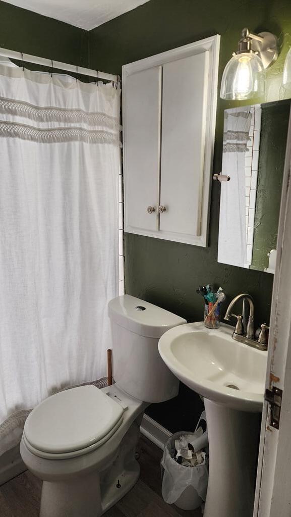 2126 S 16th St, Sheboygan, WI 53081 - bathroom with toilet and curtained shower
