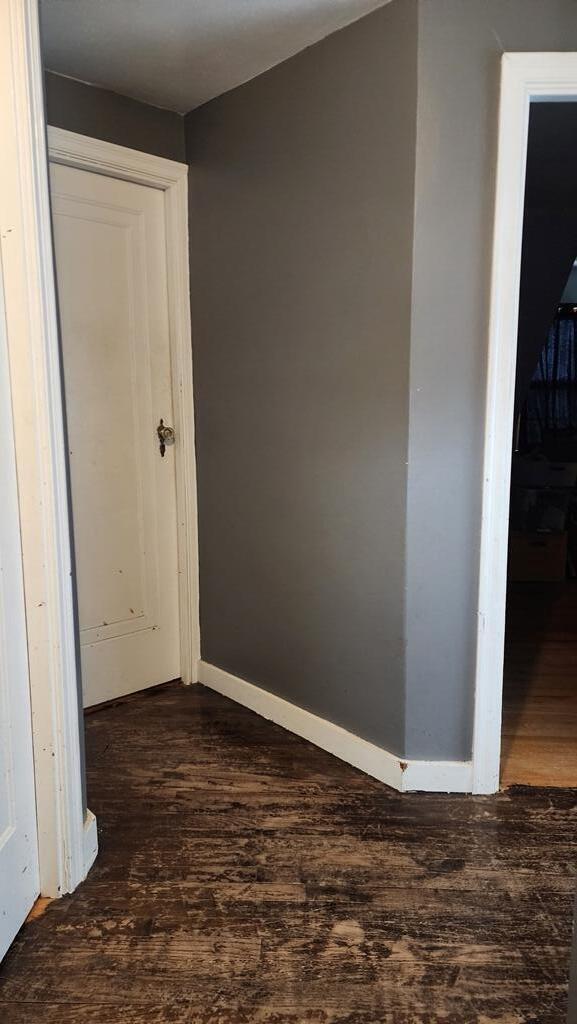 2126 S 16th St, Sheboygan, WI 53081 - corridor featuring dark wood-style flooring and baseboards