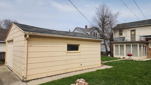 2126 S 16th St, Sheboygan, WI 53081 - view of home's exterior with a balcony, a yard, a garage, and a shingled roof