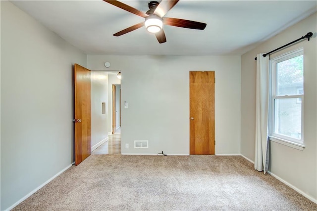 1708 Rist Ave, Eau Claire, WI 54701 - unfurnished bedroom with carpet flooring, baseboards, and a ceiling fan