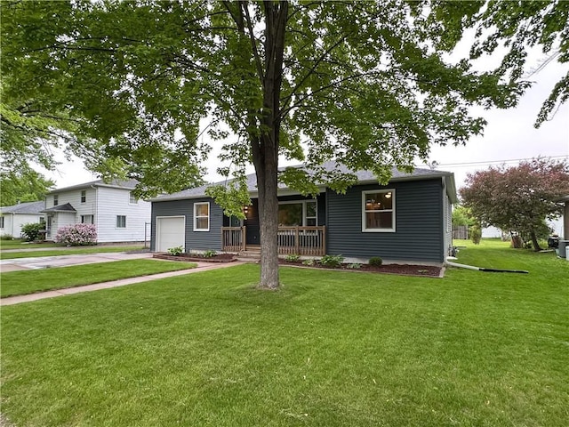 1708 Rist Ave, Eau Claire, WI 54701 - view of front of property with a garage, concrete driveway, a porch, and a front yard