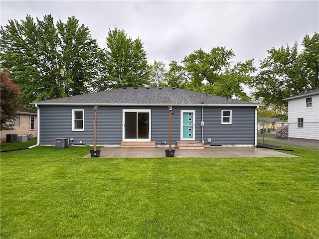 1708 Rist Ave, Eau Claire, WI 54701 - rear view of house featuring entry steps, a patio area, and central AC