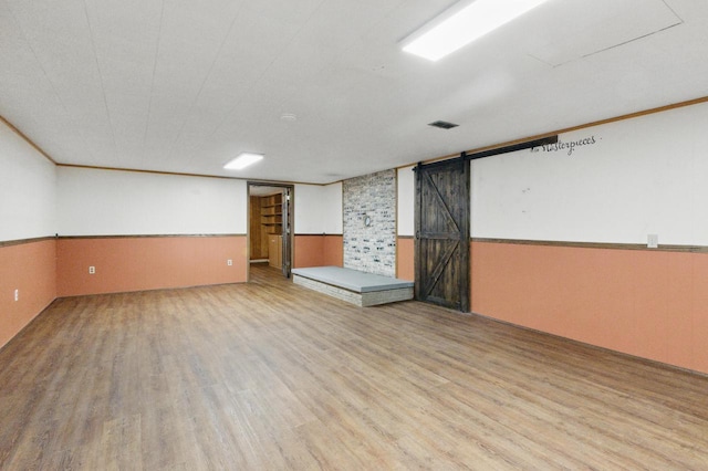 106 Elm St, Westby, WI 54667 - spare room with wood finished floors and a wainscoted wall