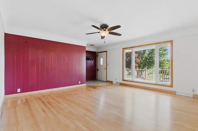 106 Elm St, Westby, WI 54667 - unfurnished room featuring wood finished floors, a ceiling fan, and baseboards