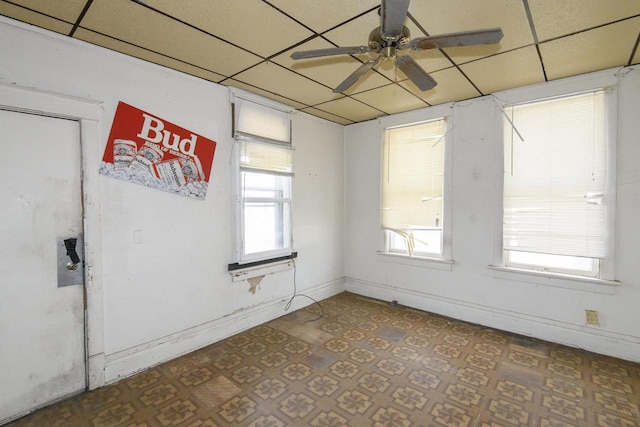 2601 S 8th St Unit 2605, Milwaukee, WI 53215 - spare room with a drop ceiling, a ceiling fan, and tile patterned floors