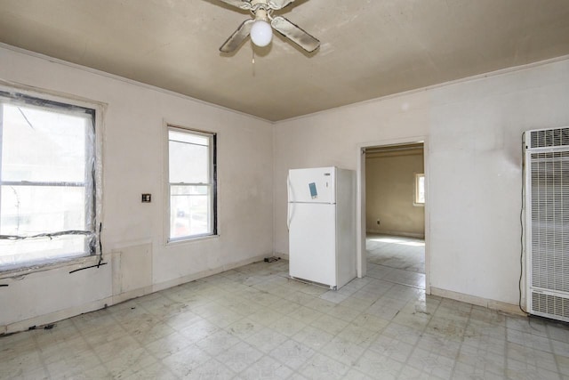 2601 S 8th St Unit 2605, Milwaukee, WI 53215 - unfurnished room with a heating unit, light floors, and healthy amount of natural light