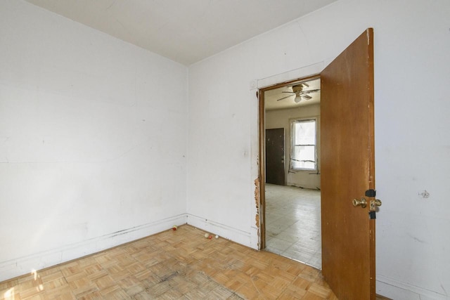 2601 S 8th St Unit 2605, Milwaukee, WI 53215 - spare room with baseboards and a ceiling fan