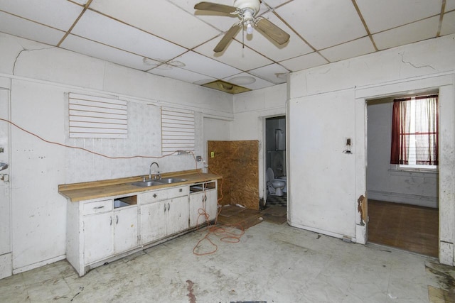 2601 S 8th St Unit 2605, Milwaukee, WI 53215 - kitchen featuring a paneled ceiling, a sink, a ceiling fan, and light countertops