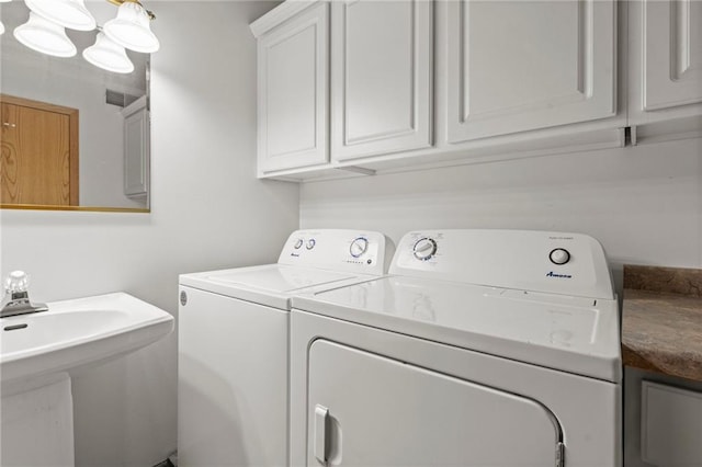 568 26th Ave, Cumberland, WI 54829 - washroom with washing machine and clothes dryer and cabinet space