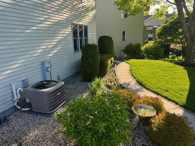 35 Sammy Jo Cir, Fond Du Lac, WI 54935 - view of green lawn featuring central air condition unit