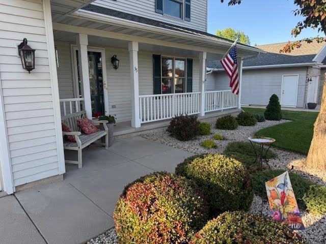 35 Sammy Jo Cir, Fond Du Lac, WI 54935 - property entrance with a porch