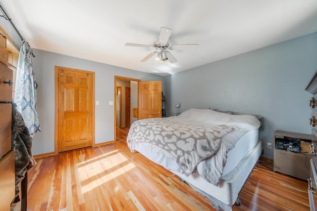 7459 Jensen Rd, Oshkosh, WI 54904 - bedroom featuring wood finished floors, ceiling fan, and baseboards