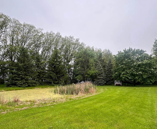 7459 Jensen Rd, Oshkosh, WI 54904 - view of grassy yard with a view of trees