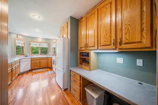 7459 Jensen Rd, Oshkosh, WI 54904 - kitchen with white appliances, light wood finished floors, brown cabinets, light countertops, and recessed lighting