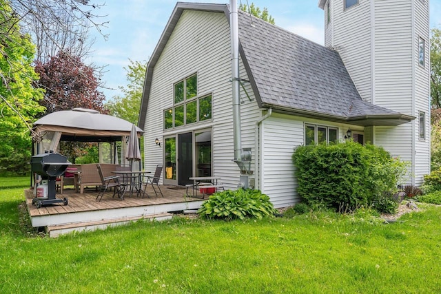 7459 Jensen Rd, Oshkosh, WI 54904 - rear view of property with a gazebo, a shingled roof, a wooden deck, and a yard