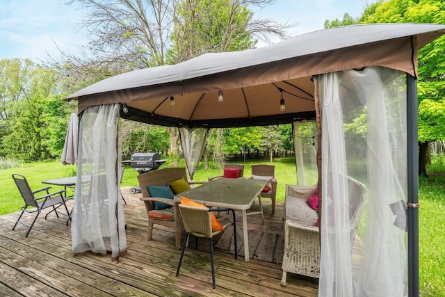 7459 Jensen Rd, Oshkosh, WI 54904 - deck with a gazebo, outdoor dining area, and a yard